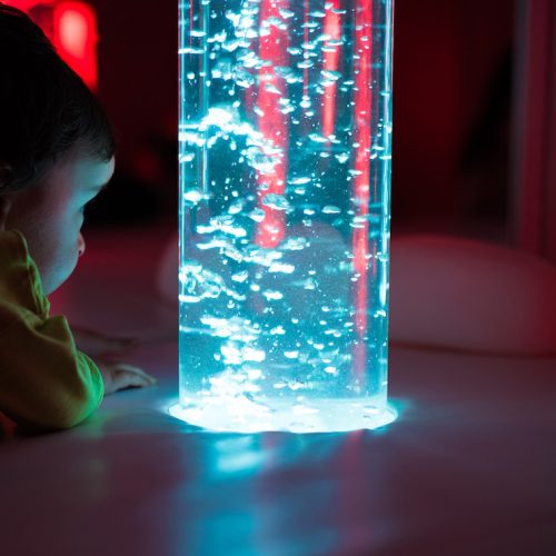 Young kid exploring a multi sensory space - snoezelen concept